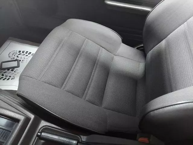 Gray patterned cloth driver seat of the 1987 Nissan 200SX XE in clean condition
